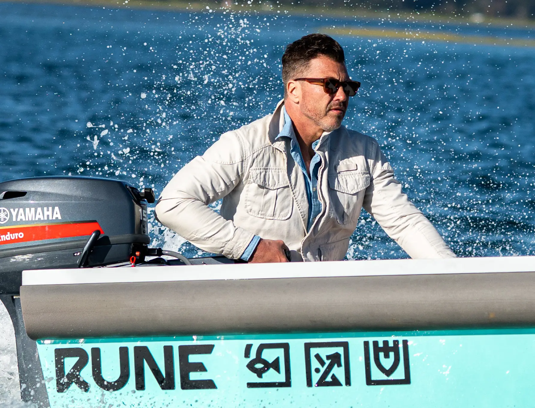 RUNE aluminium tender cutting across open water
